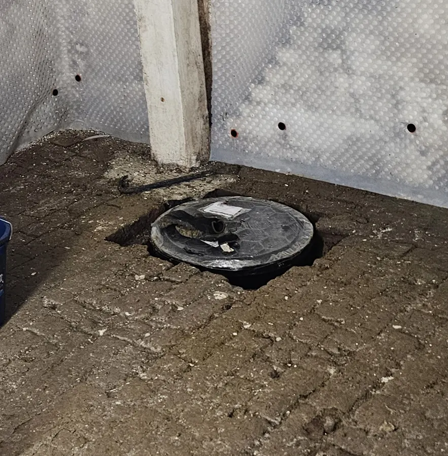 Sump chamber lid set into a cellar floor during a cavity membrane installation